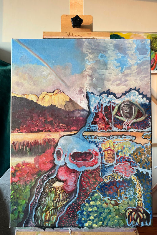 Colorful abstract painting on an easel with a mountain and nature elements.