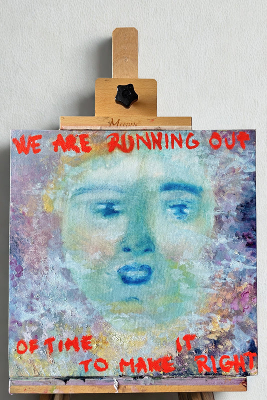 Artistic depiction of a face with text on an easel against a light gray background