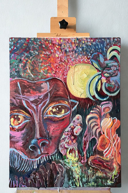 Colorful abstract painting on a canvas with a wooden easel.